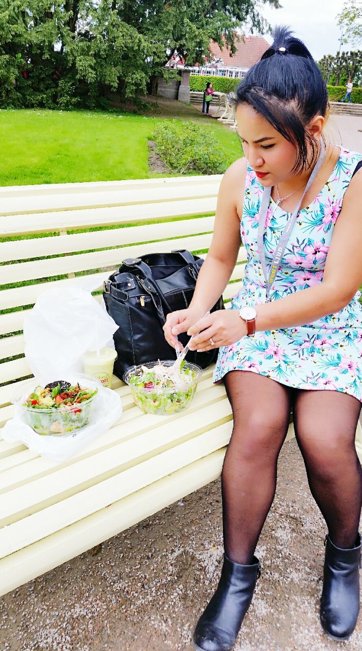 lifestyles, leisure activity, childhood, girls, elementary age, person, casual clothing, park - man made space, young women, holding, standing, grass, flower, full length, sitting, freshness, young adult