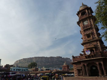 Buildings in city against sky