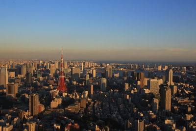 Aerial view of modern buildings in city against clear sky