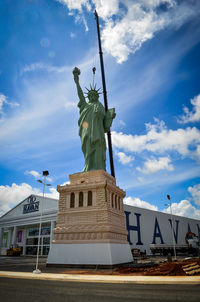 Low angle view of statue against cloudy sky