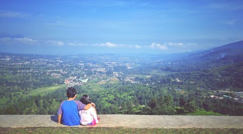 Scenic view of landscape against cloudy sky