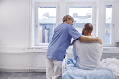 Nurse taking care of patient in hospital