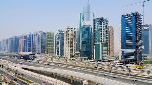 Modern buildings in city against clear sky