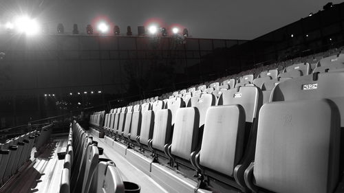 Panoramic shot of illuminated chairs at night