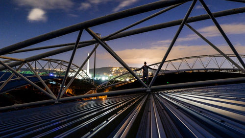 Bridge against sky in city