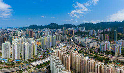 High angle view of buildings in city against sky