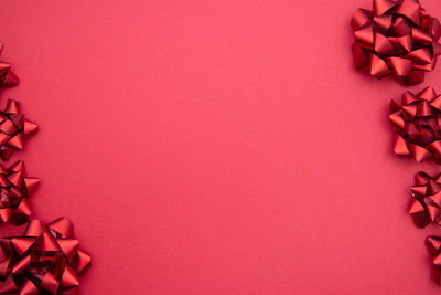 High angle view of pink petals on paper