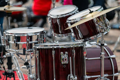 A set of plates in a drum set. at a concert of percussion music, selective focus, close-up