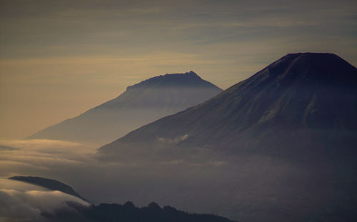 Scenic view of mountains against sky during sunset