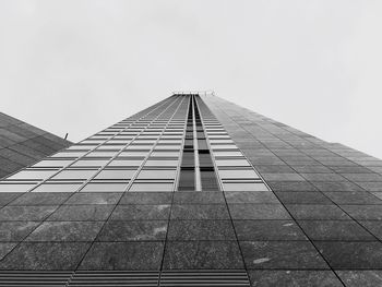 Low angle view of skyscraper against clear sky