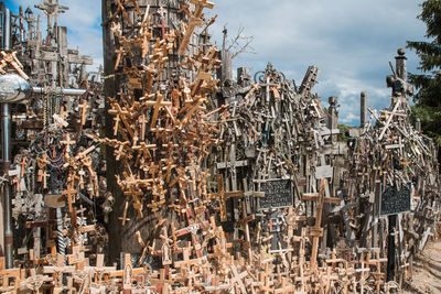 Stack of metal structure in city against sky