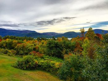 Scenic view of mountains against cloudy sky