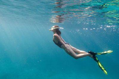 Woman swimming in sea