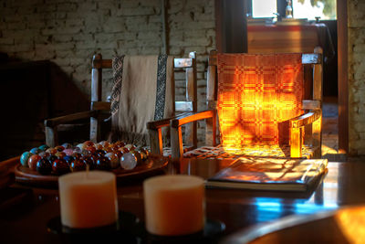 Close-up of illuminated candles on table