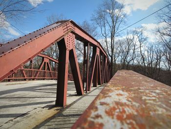 Bridge over footpath against sky