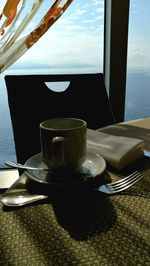 Close-up of coffee cup on table