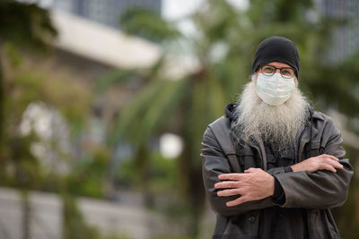 Portrait of man standing outdoors