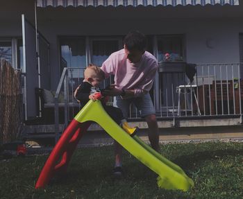 Friends boy playing on building