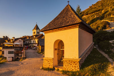 Mount lussari. fiery sunset over the sanctuary and the julian alps. italy