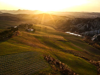 Scenic view of field against sky during sunset