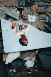 High angle portrait of young man looking at camera