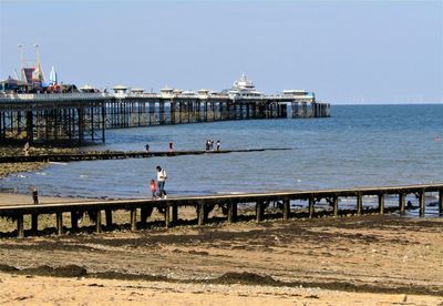 Pier over sea against clear sky