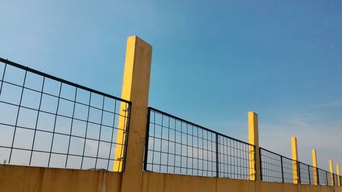 Metallic structure against blue sky