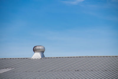 Low angle view of building against clear blue sky