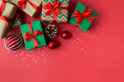 High angle view of christmas decorations on red surface