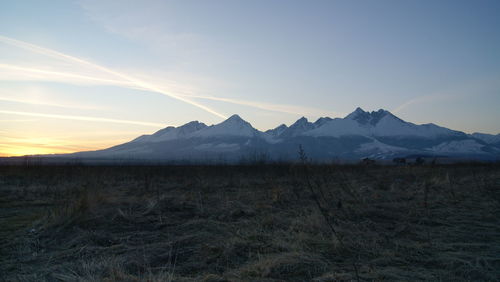 View of landscape against mountain range