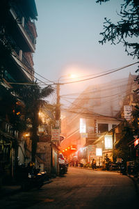 City street amidst buildings against sky