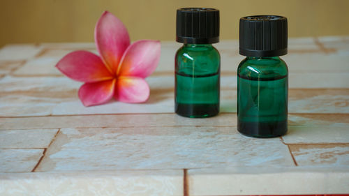 Close-up of multi colored bottles on table