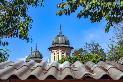 Low angle view of temple against clear blue sky