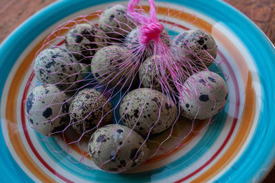 High angle view of candies in bowl on table