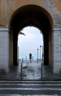 Rear view of woman walking in building