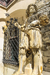 Low angle view of statue against building