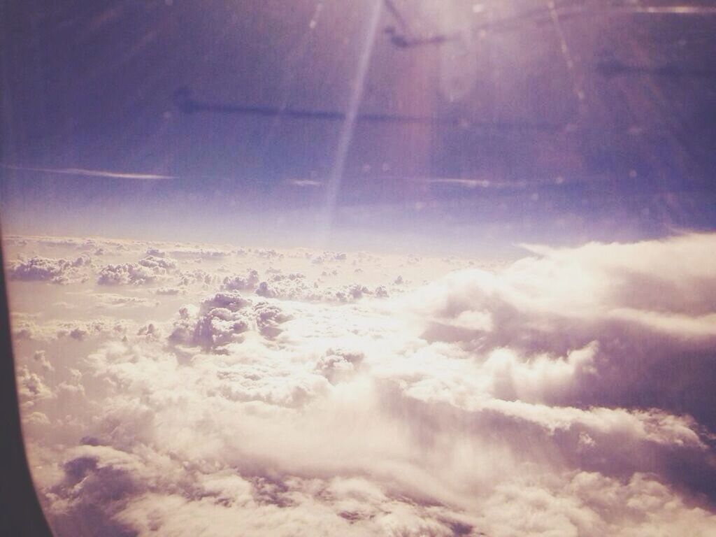 sky, scenics, beauty in nature, cloud - sky, aerial view, nature, tranquil scene, cloudscape, tranquility, sunbeam, airplane, idyllic, cloud, sunlight, sun, sky only, cloudy, blue, no people, landscape