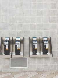 Pay phones mounted on wall