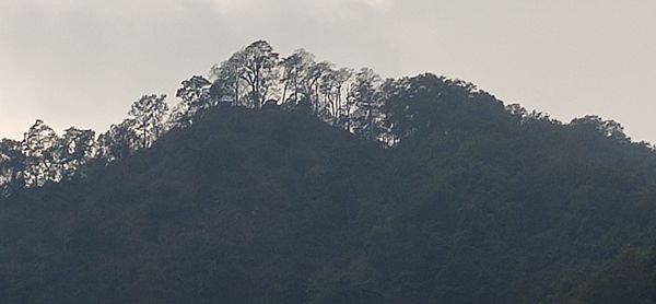 Low angle view of snowcapped mountains against sky