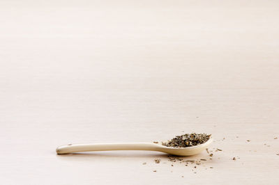 High angle view of bread on table against white background