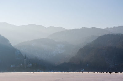 Scenic view of mountains against sky during winter