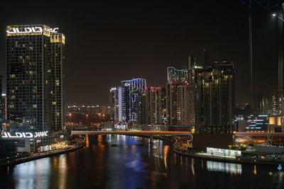 Illuminated buildings in city at night
