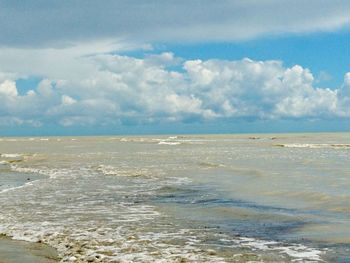 Scenic view of sea against cloudy sky