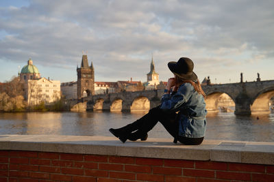 Side view of man sitting on steps