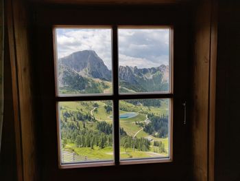 Scenic view of mountains seen through window