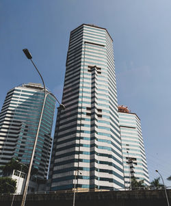 Low angle view of modern buildings against clear sky