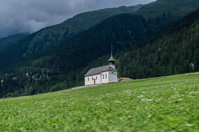 Scenic view of green mountains against sky