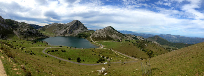 Scenic view of mountains against cloudy sky