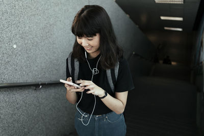 Young woman using mobile phone