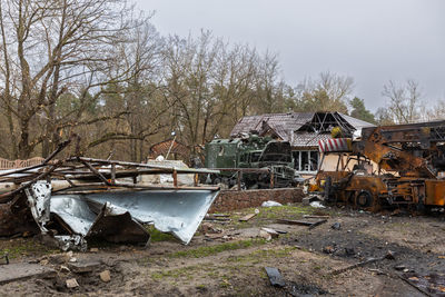 Destroyed military equipment on the streets of the city. lots of burnt and shelled vehicles.